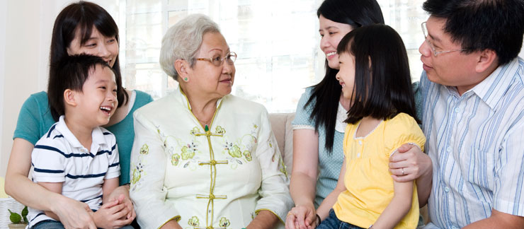 Elderly woman with family during the holidays.